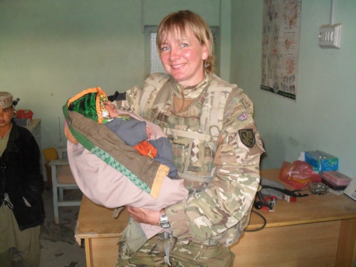 Captain Lisa Irwin with an Afghan baby