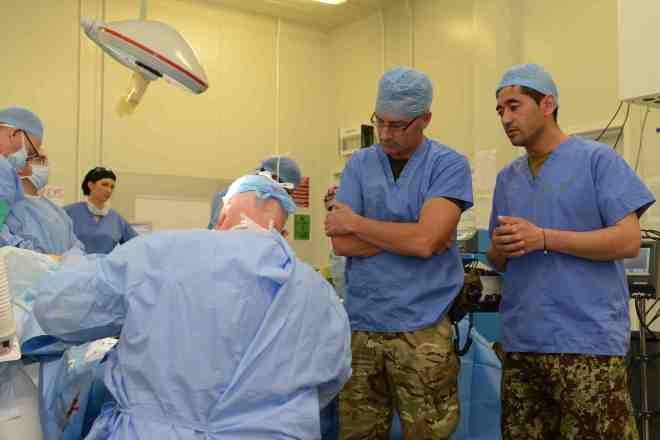 ISAF are teaching the afghan doctors and surgeons more advanced medical techniques to enable them to look after and care for the more seriously injured soldiers. Sgt Barry Pope RLC (Phot)